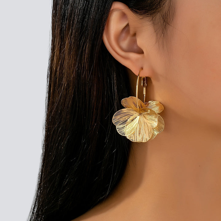 Boucles d'oreilles creuses en or exagérées