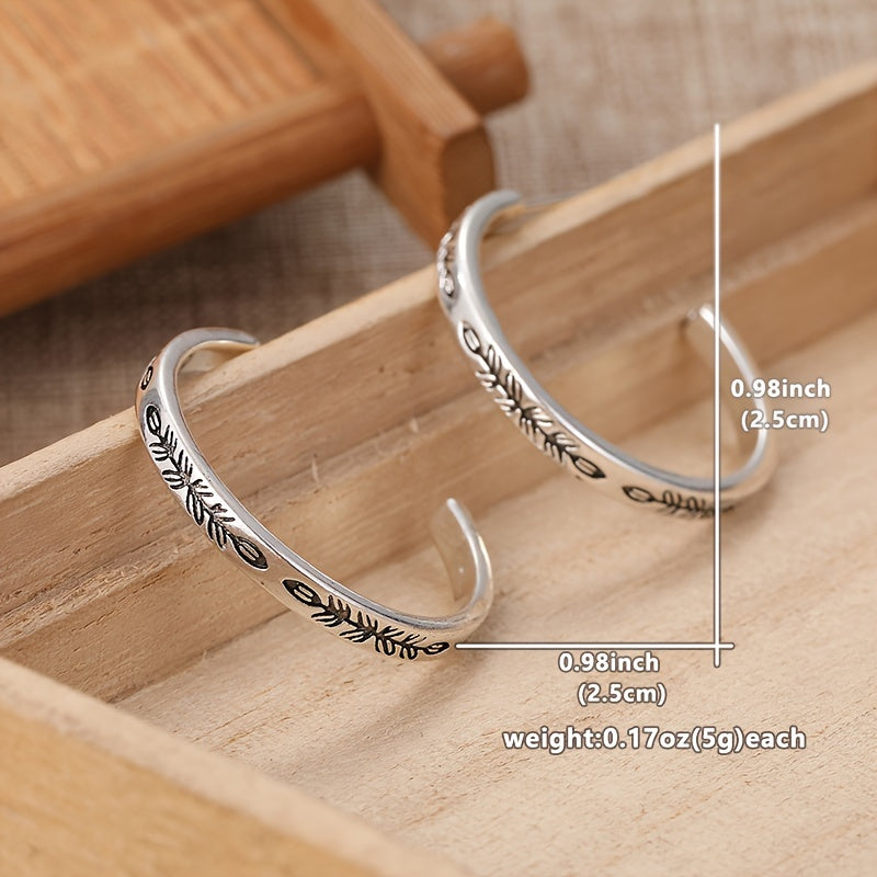 Boucles d'oreilles créoles argentées uniques