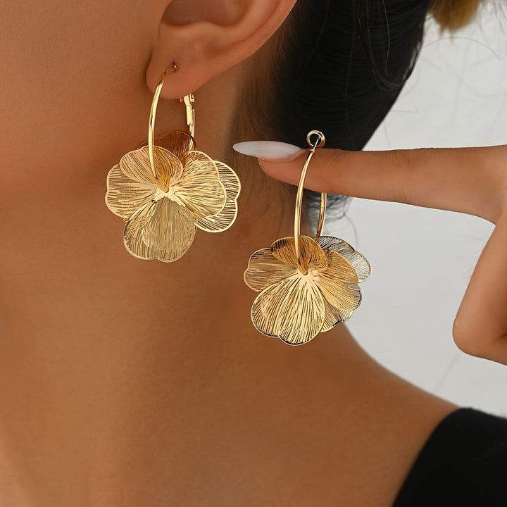 Boucles d'oreilles creuses en or exagérées