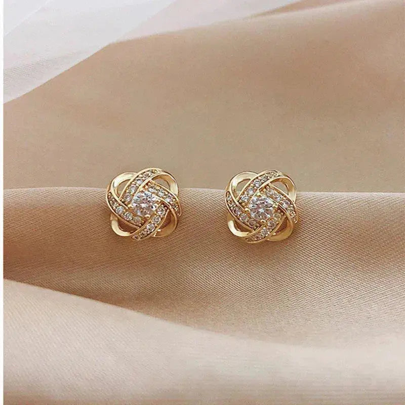 Boucles d'oreilles en cristal floral spiralé doré