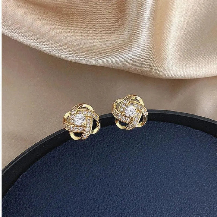 Boucles d'oreilles en cristal floral spiralé doré