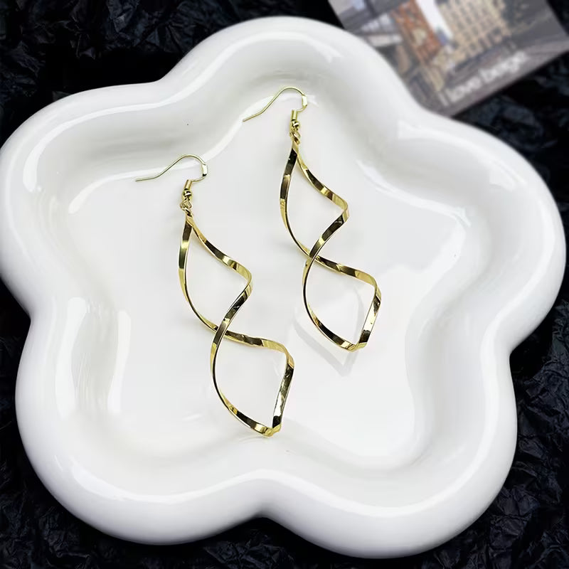 Boucles d'oreilles pendantes en spirale | Or