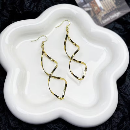 Boucles d'oreilles pendantes en spirale | Or