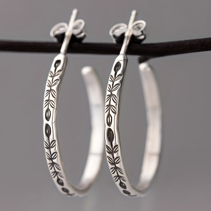 Boucles d'oreilles créoles argentées uniques