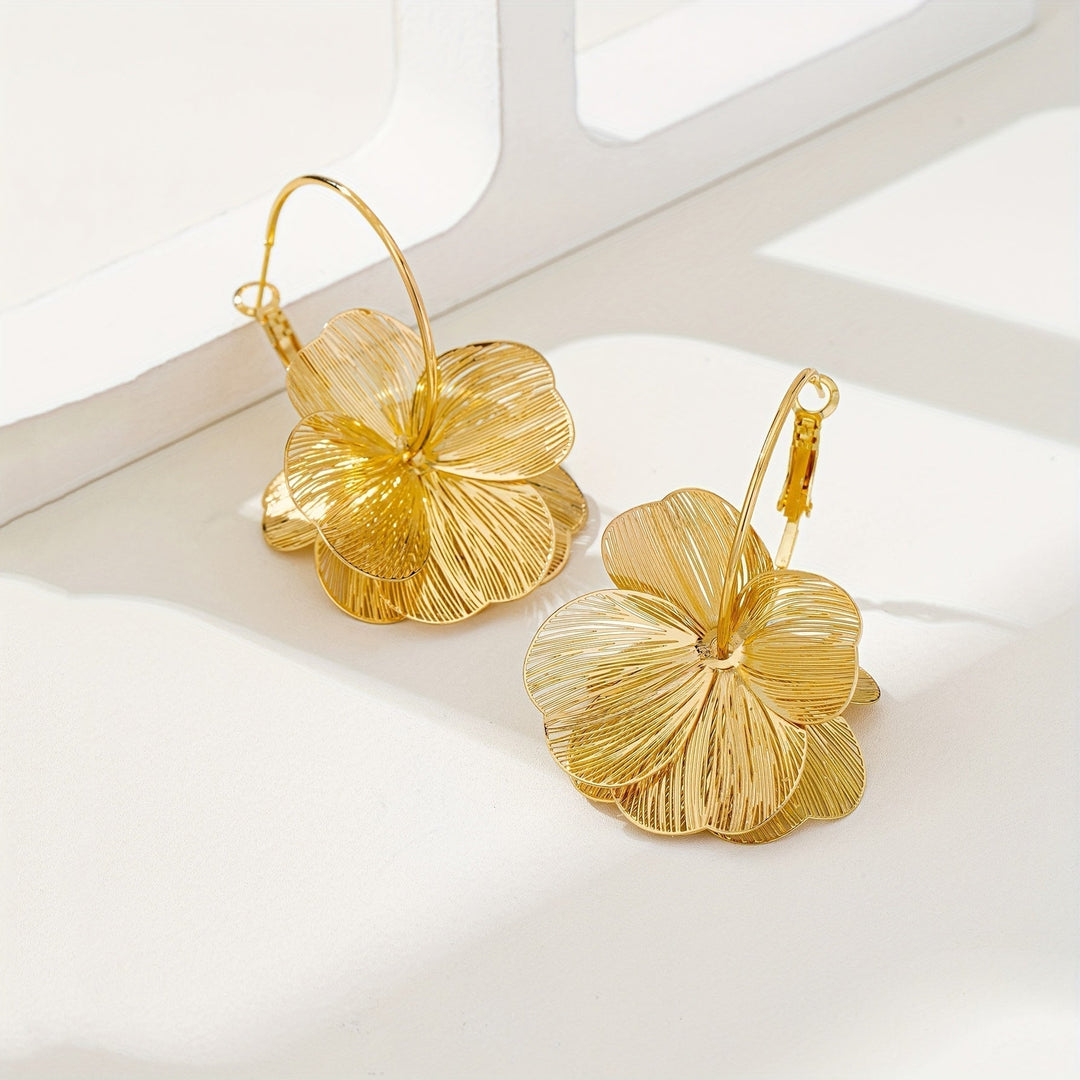 Boucles d'oreilles creuses en or exagérées