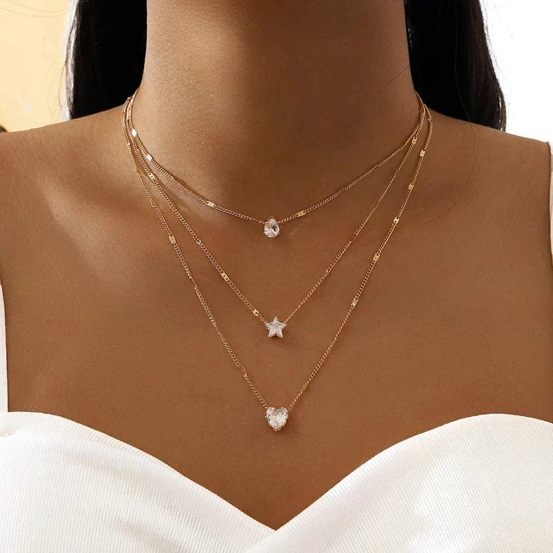 Collier avec pendentifs triples et zirconiums en or