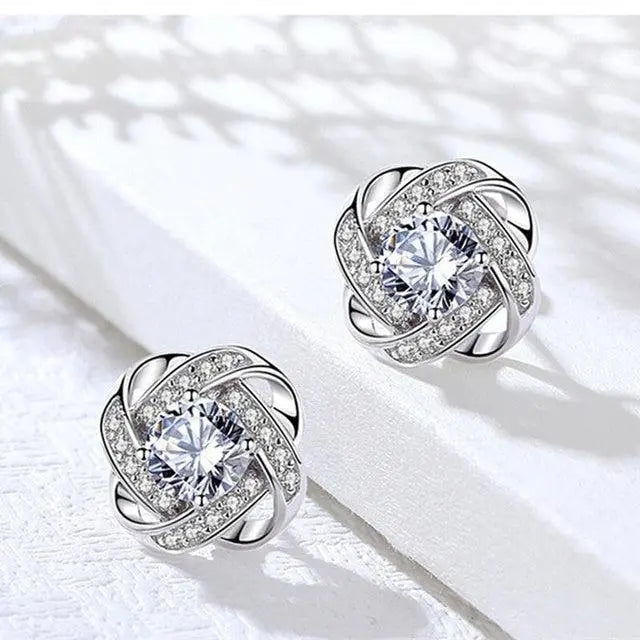 Boucles d'oreilles en cristal floral spiralé doré