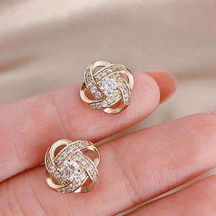 Boucles d'oreilles en cristal floral spiralé doré