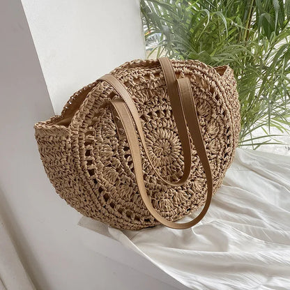 Arnora | Sac rond tressé avec poignées en simili cuir