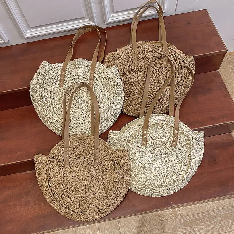 Arnora | Sac rond tressé avec poignées en simili cuir