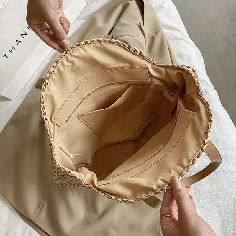 Arnora | Sac rond tressé avec poignées en simili cuir
