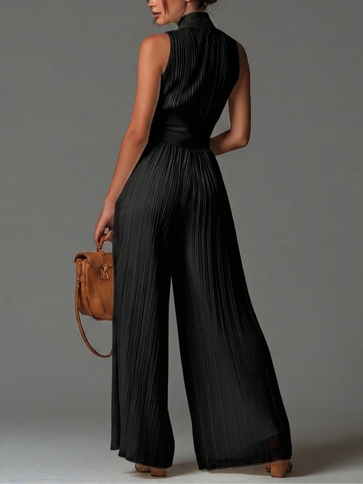 Combinaison sans manches à col en V noir avec fermeture éclair et plissée à jambes larges en chiffon